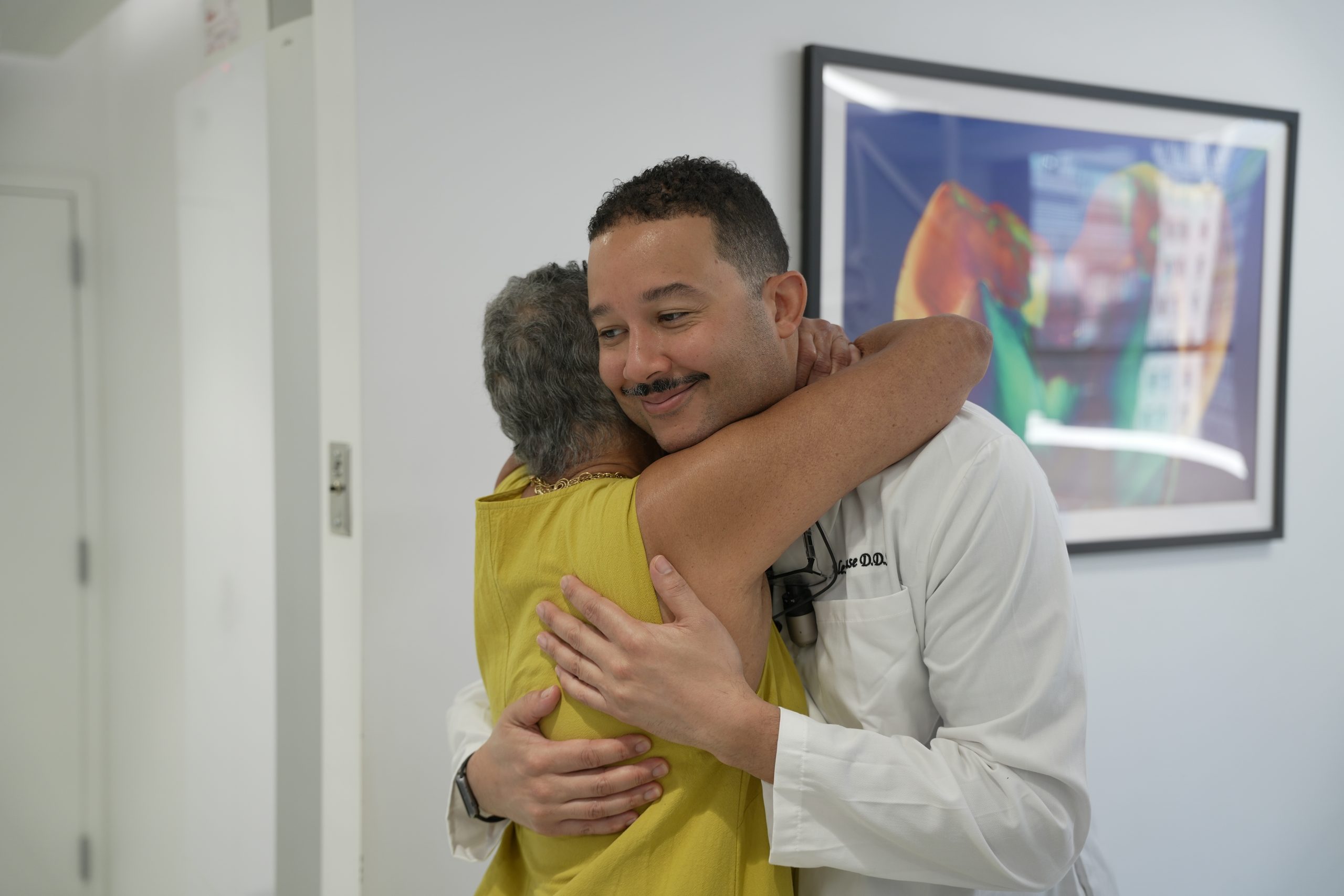 Dr. Gause hugging a patient
