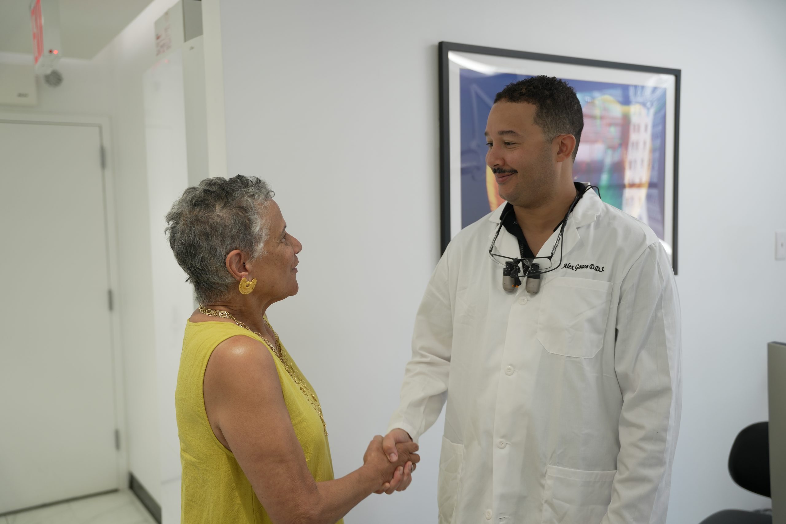 Dr. Gause shaking a patient’s hand